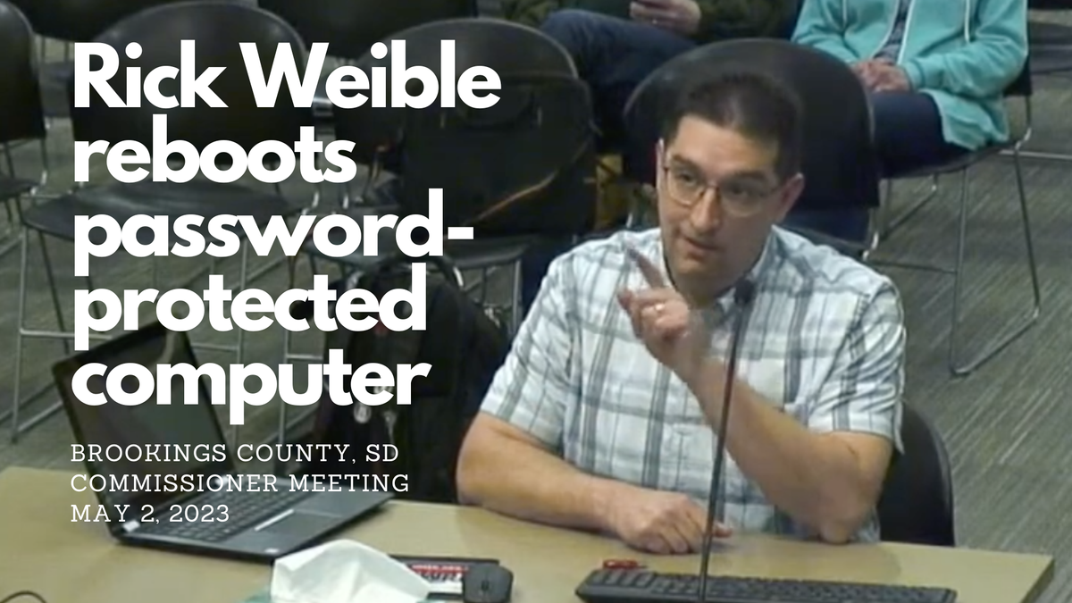 Rick Weible reboots password-protected computer in Brookings, South Dakota during commissioner meeting